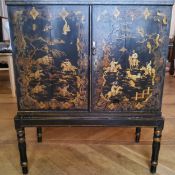 An '18th century' black lacquer japanned collector's cabinet on stand, the chinoiserie interior