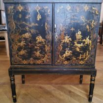 An '18th century' black lacquer japanned collector's cabinet on stand, the chinoiserie interior