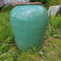 A monumental turquoise glazed terracotta amphora style garden planter, Approximately 80cm high