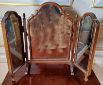 A Victorian style mahogany triptych dressing table mirror, acorn finials, scroll legs