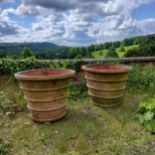 An impressive pair of substantial terracotta country house estate planters 53cms high x 67.5cms dia.