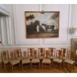 A fine set of twelve golden pollard oak dining chairs, well figured with oak leaf and acorn