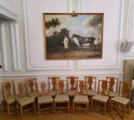 A fine set of twelve golden pollard oak dining chairs, well figured with oak leaf and acorn