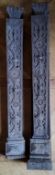 A pair of early 19th century carved oak mantel legs, decorated with flowers & geometric shapes,