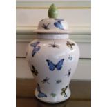 Withdrawn broken in view - A large baluster shaped jar & cover, decorated with butterflies,