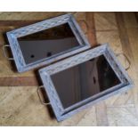 A pair of brass filigree two handled drinks trays with mirror base 39.5 x 70cms