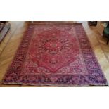 A large hand finished Mashad Persian carpet 390cm x 293cm
