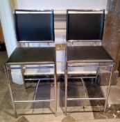 A modern pair of chrome and black leatherette bar stools, 41cm w x 38cm d x 96cm h