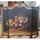 A decorative triptych table/fire screen hand painted with a still life observation of a harvest of a