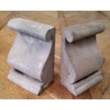 A pair of reconstituted scrolling ogee corbels, useful as bookends, polished concrete, standing 23cm
