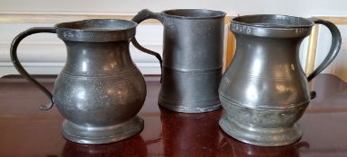 A George IV pewter quart tankard, stamped with GR to ER stamps; another stamped MW & Imperial etc.