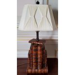 A pair of substantial carved wood lamp bases in form of leather bound antiquarian books picked out