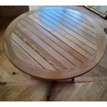 An oak & aluminium garden table, quadruped base 60cms dia. x 70cms high
