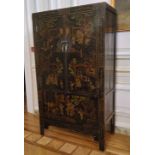 An 18th century style Chinese black lacquered marriage chest, decorated with pseudo-Oriental