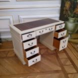 A reproduction kneehole desk painted white, tooled leather inlay, 122cm long x 61cm deep x 76cm high