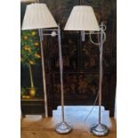 A pair of modern chromed swing arm reading lamps. PAT TESTED.