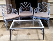 A set of three 'George III' Chinese Chippendale Revival faux bamboo elbow chairs, painted and