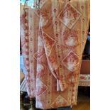 A pair of pencil pleat linen curtains toile du jouy style fabric in tones of red on a cream ground