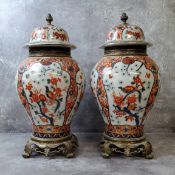 A pair of large baluster shaped vases in the Imari pallette with gilt metal mounts, blue sevres type