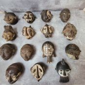 Fifteen Tikar clay Passport masks - Miniature masks are carved to embody tutelary spirits and