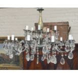 A continental early 20th century 15 branch brass and crystal glass drop chandelier converted to