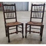 A pair of early 19th century ash and elm farmhouse hall chairs