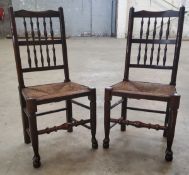 A pair of early 19th century ash and elm farmhouse hall chairs