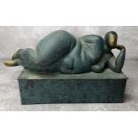 A verdigris bronze abstract nude raised on a plinth base, 12" long