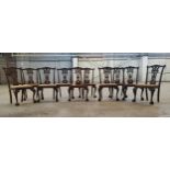 A set of ten Hepplewhite type walnut dining chairs, acanthus carved capped forelegs terminating in