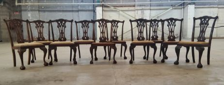 A set of ten Hepplewhite type walnut dining chairs, acanthus carved capped forelegs terminating in