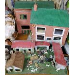 A scratch built farm with plastic & lead animals, tractor & trailer; a home built dolls house;