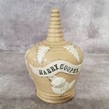An early stoneware money bank with name plaque for " Harry Cooper ", most likely produced by