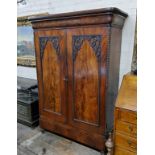 A 19th century French flamed mahogany linen press, later converted to a wardrobe, one long drawer to