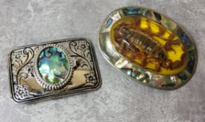 A large Mexican belt buckle, the centre mounted with a resin encapsulated scorpion, abalone