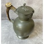 A late Victorian James Dixon & Son pewter claret jug with hinged cover, Bacchus mask to spout,