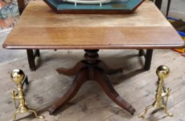 A Victorian mahogany Pembroke table, bold turned column with outswept fluted legs, brass castors