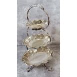 A Walker & Hall silver plated three tier graduated tea stand, fluted wavy edged removal oval