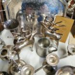 Silver plate including a pair of open barley twist candlesticks, tankard, letter rack, grape