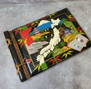 A Japanese lacquer photograph album, the cover hand painted with a map of Japan the cities marked