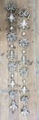 A pair of decorative silvered hanging wall sconces 133cms H