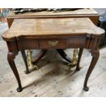 A George II period card table of Chippendale design, with a hinged top of shaped outline above the