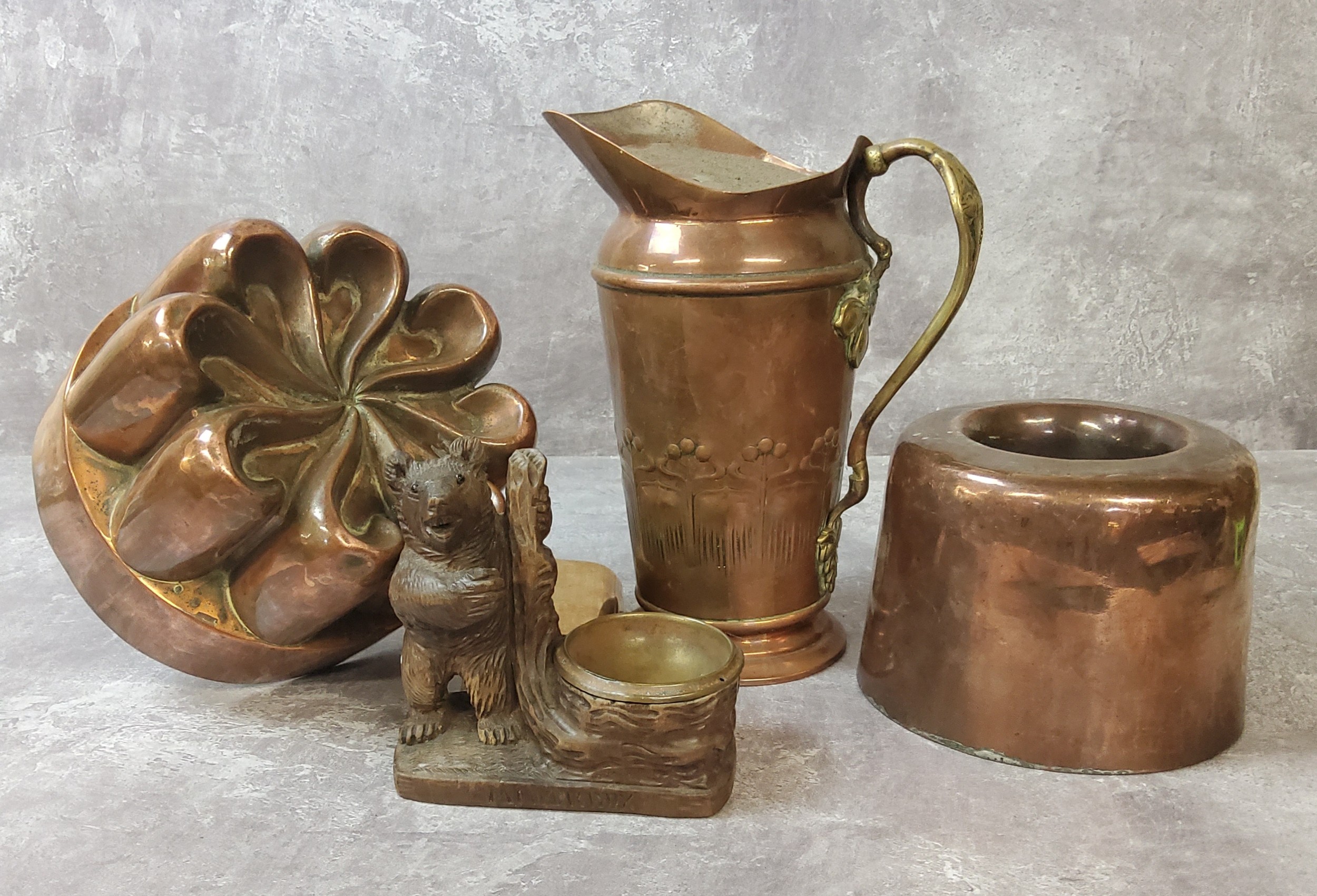 A Victorian copper jelly mould c.1900 of spiralling form; another circular mould by Jones Bros 4