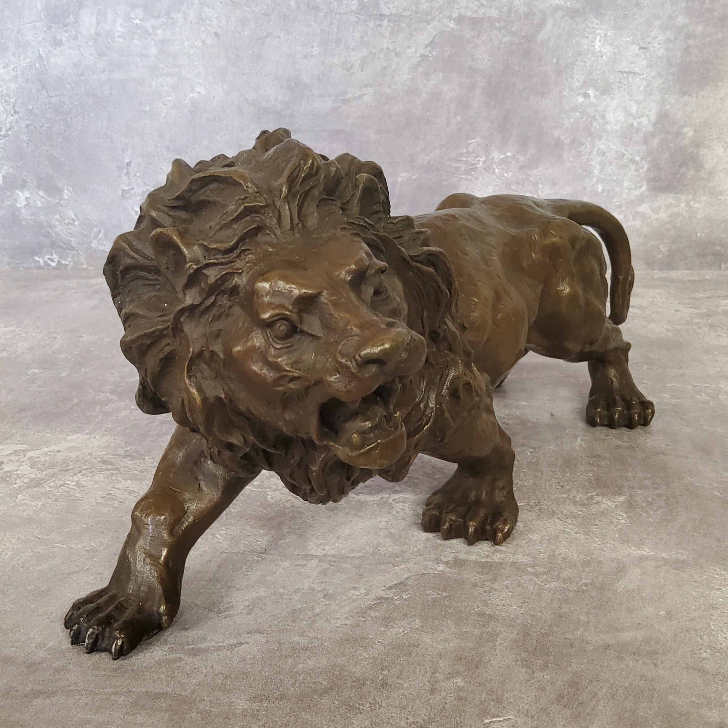 A bronze library model of a ferocious lion, bearing the signature, Rodin 31cm in length - Image 4 of 4