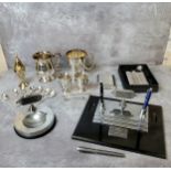 A marble based presentation desk tidy; a conforming engine turned presentation ash tray; hip flasks;