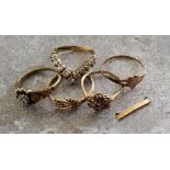 A 9ct gold wishbone ring claw set with nine round white stones, 2.36g; a 9ct gold knot ring 1.78g; a