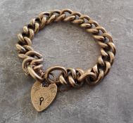 An early 20th century 9ct rose gold hollow charm bracelet, heart shaped padlock, engraved decoration