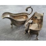 A pair of Edwardian sauce boats, gadrooned borders, acanthus-capped scroll handle, hoof feet,