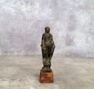 A 19th century spelter figure of a king possibly a chess piece mounted on wooden plinth (af)