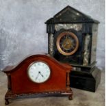 An early 20th century French time piece raised on ball and claw feet; a Victorian belge noir slate
