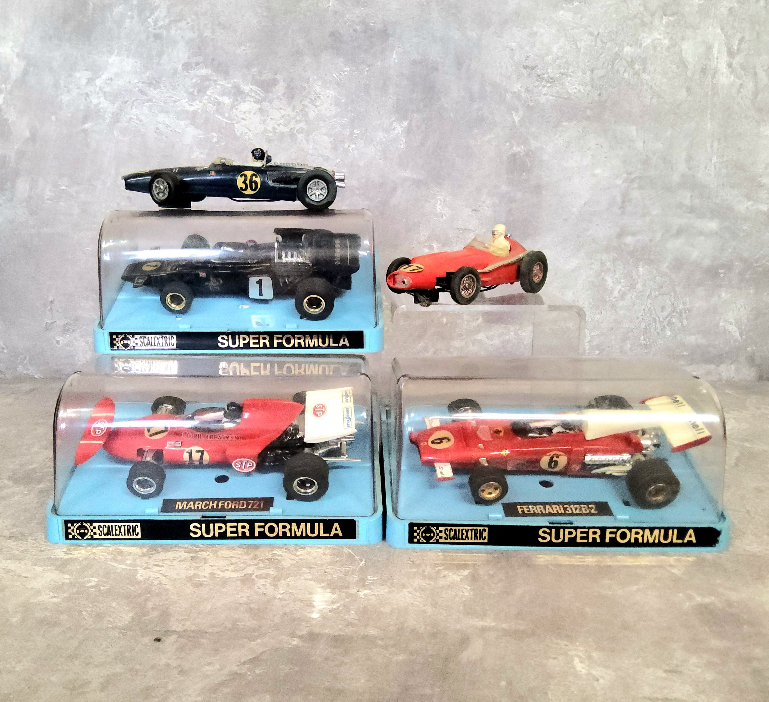 An Airfix MRRC 5196 1950's Maserati 250F F1 slot car; a 1960's Airfix Scalextric Eagle Westlake T1G;